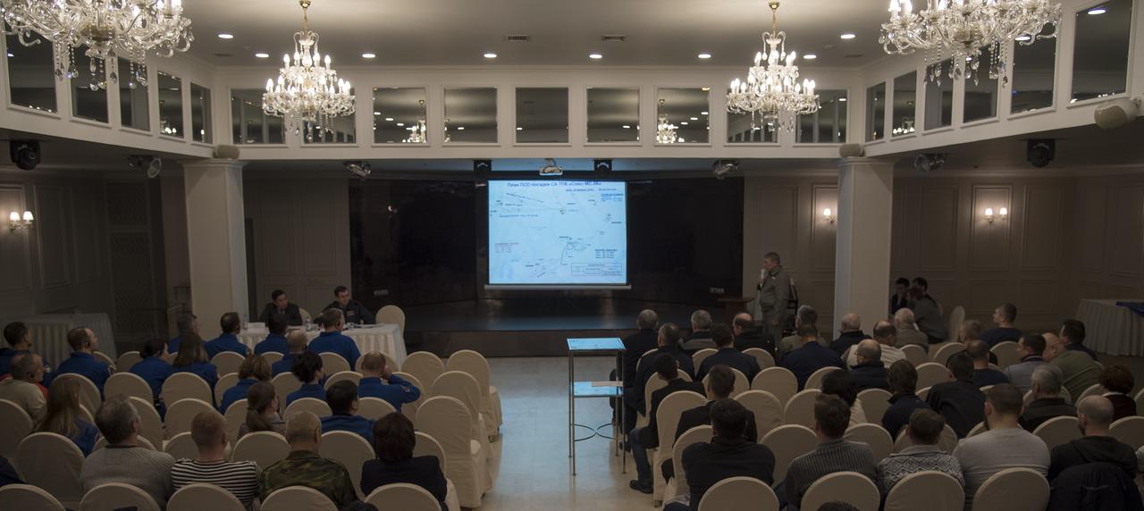 NASA and Roscosmos team members, along with Russian Search and Recovery Forces, meet to discuss the readiness for the landing of Expedition 54 crew members Joe Acaba and Mark Vande Hei of NASA and cosmonaut Alexander Misurkin Sunday, Feb. 25, 2018. Acaba, Vande Hei, and Misurkin are returning after 168 days in space where they served as members of the Expedition 53 and 54 crews onboard the International Space Station. Photo Credit: (NASA/Bill Ingalls)