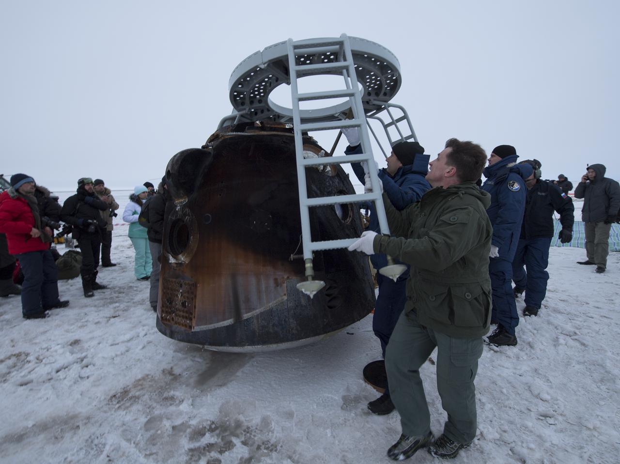 Russian Search and Rescue teams arrive at the Soyuz MS-06 spacecraft shortly after it landed with Expedition 54 crew members Joe Acaba and Mark Vande Hei of NASA and cosmonaut Alexander Misurkin near the town of Zhezkazgan, Kazakhstan on Wednesday, Feb. 28, 2018 (February 27 Eastern time.) Acaba, Vande Hei, and Misurkin are returning after 168 days in space where they served as members of the Expedition 53 and 54 crews onboard the International Space Station. Photo Credit: (NASA/Bill Ingalls)