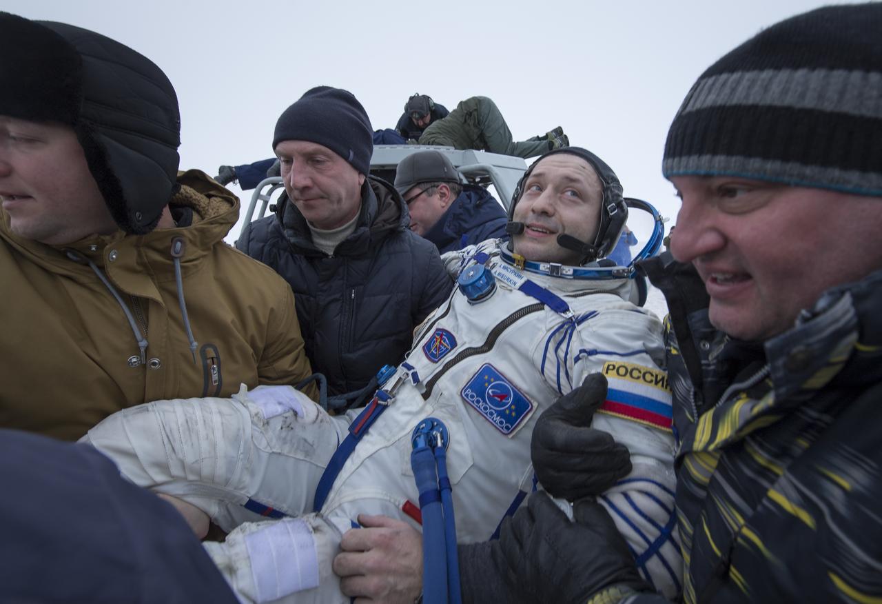 Russian cosmonaut Alexander Misurkin is helped out of the Soyuz MS-06 spacecraft just minutes after he, NASA astronauts Joe Acaba, and Mark Vande Hei, landed in a remote area near the town of Zhezkazgan, Kazakhstan on Wednesday, Feb. 28, 2018 (February 27 Eastern time.) Acaba, Vande Hei, and Misurkin are returning after 168 days in space where they served as members of the Expedition 53 and 54 crews onboard the International Space Station. Photo Credit: (NASA/Bill Ingalls)