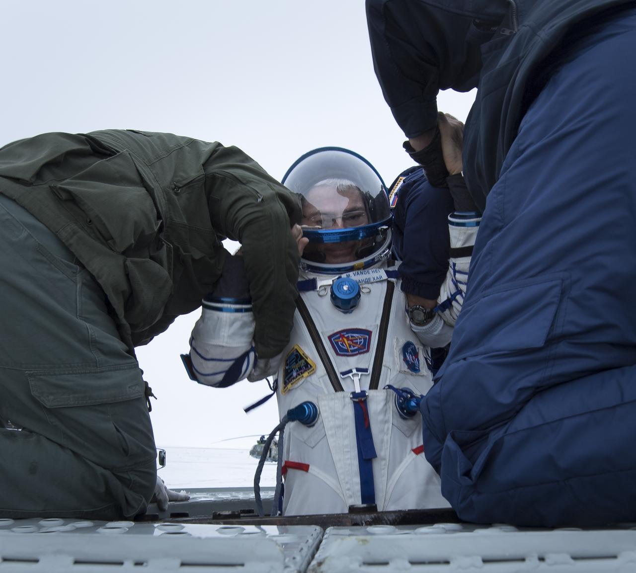NASA astronaut Mark Vande Hei is helped out of the Soyuz MS-06 spacecraft just minutes after he, NASA astronaut Joe Acaba, and Russian cosmonaut Alexander Misurkin landed in a remote area near the town of Zhezkazgan, Kazakhstan on Wednesday, Feb. 28, 2018 (February 27 Eastern time.) Acaba, Vande Hei, and Misurkin are returning after 168 days in space where they served as members of the Expedition 53 and 54 crews onboard the International Space Station. Photo Credit: (NASA/Bill Ingalls)