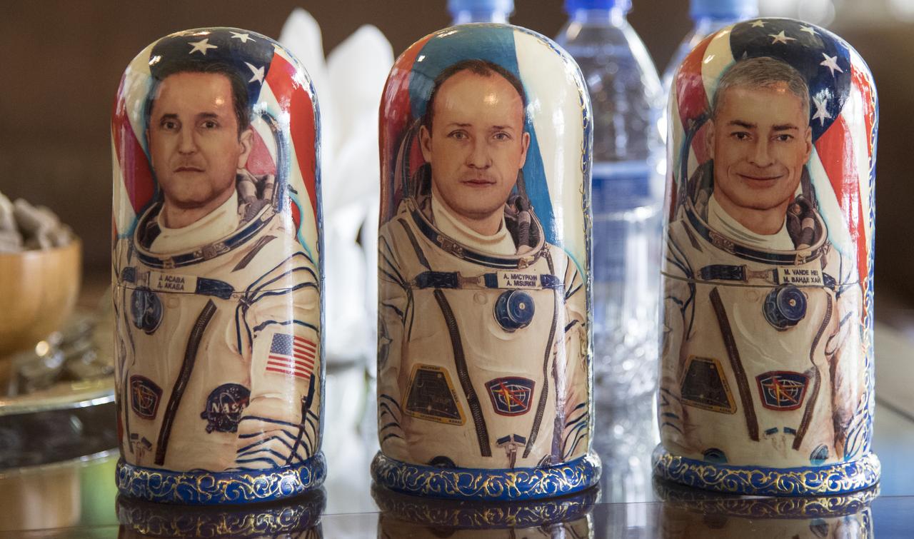 Matryoshka Dolls depicting NASA astronaut Joe Acaba, left, Russian cosmonaut Alexander Misurkin, center, and NASA astronaut Mark Vande Hei are seen during a welcome ceremony Wednesday, Feb. 28, 2018 in the Zhezkazgan Airport, Kazakhstan.  Acaba, Vande Hei, and Misurkin are returning after 168 days in space where they served as members of the Expedition 53 and 54 crews onboard the International Space Station. Photo Credit: (NASA/Bill Ingalls)