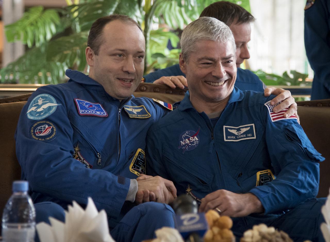 Expedition 54 crew members Alexander Misurkinat of Roscosmos, left, and NASA astronaut Mark Vande Hei are seen during a welcome ceremony at the Zhezkazgan Airport on Wednesday, Feb. 28, 2018. 2018 (February 27 Eastern time.)  Vande Hei, and Misurkin returned with NASA astronaut Joe Acaba after 168 days in space where they served as members of the Expedition 53 and 54 crews onboard the International Space Station. Photo Credit: (NASA/Bill Ingalls)