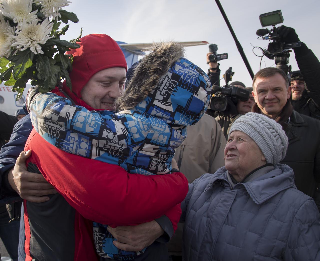 Expedition 54 cosmonaut Alexander Misurkin of the Russian space agency Roscosmos is welcomed at the Chkalovsky Airport in Star City, Russia by family and colleagues a few hours after he and NASA astronauts Joe Acaba and Mark Vande Hei landed their Soyuz MS-06 capsule near the town of Zhezkazgan, Kazakhstan on Wednesday, Feb. 28, 2018 (February 27 Eastern time.) Acaba, Vande Hei, and Misurkin are returning after 168 days in space where they served as members of the Expedition 53 and 54 crews onboard the International Space Station. Photo Credit: (NASA/Bill Ingalls)