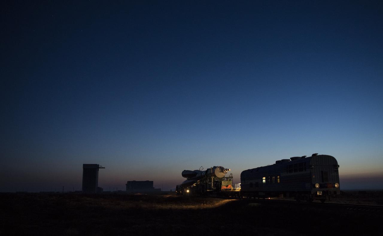 The Soyuz rocket is rolled out by train to the launch pad, Monday, March 19, 2018 at the Baikonur Cosmodrome in Kazakhstan. Expedition 55 crewmembers Ricky Arnold and Drew Feustel of NASA and Oleg Artemyev of Roscosmos are scheduled to launch at 1:44 p.m. Eastern time (11:44 p.m. Baikonur time) on March 21 and will spend the next five months living and working aboard the International Space Station. Photo Credit: (NASA/Joel Kowsky)