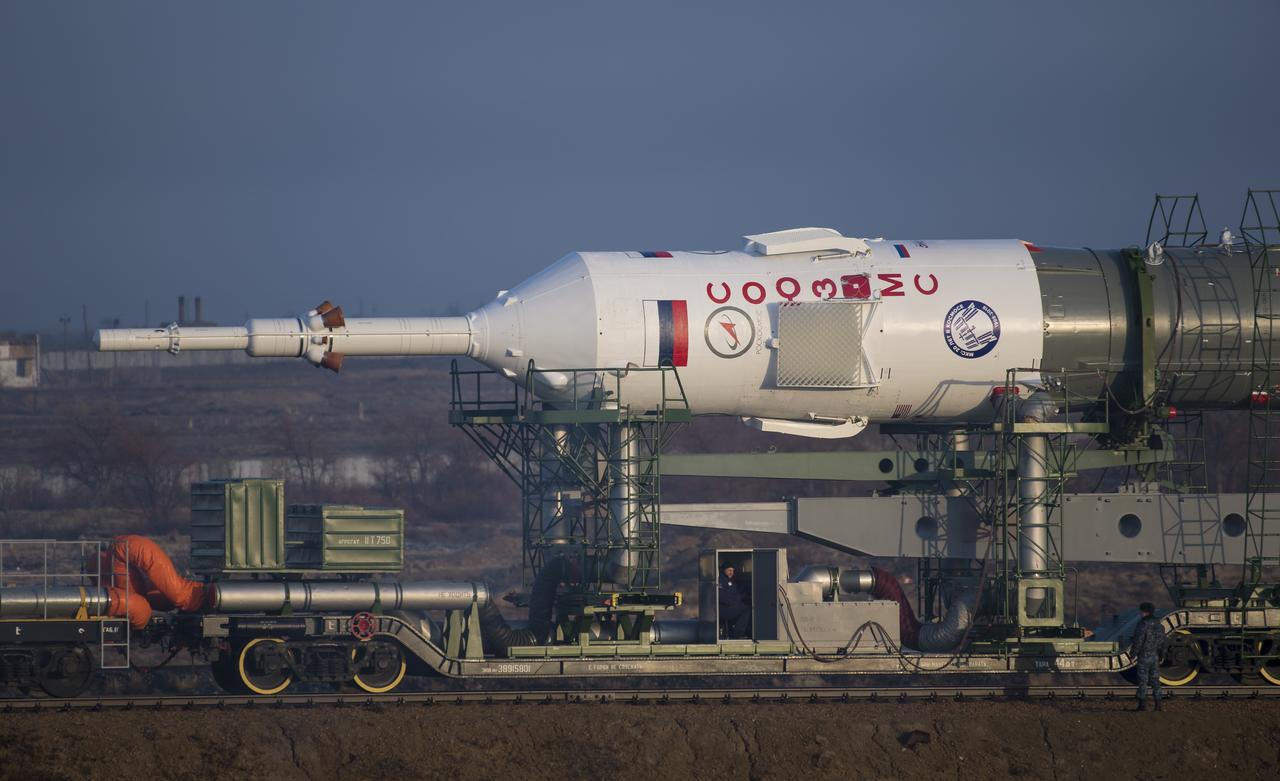 The Soyuz rocket is rolled out by train to the launch pad, Monday, March 19, 2018 at the Baikonur Cosmodrome in Kazakhstan. Expedition 55 crewmembers Ricky Arnold and Drew Feustel of NASA and Oleg Artemyev of Roscosmos are scheduled to launch at 1:44 p.m. Eastern time (11:44 p.m. Baikonur time) on March 21 and will spend the next five months living and working aboard the International Space Station. Photo Credit: (NASA/Joel Kowsky)