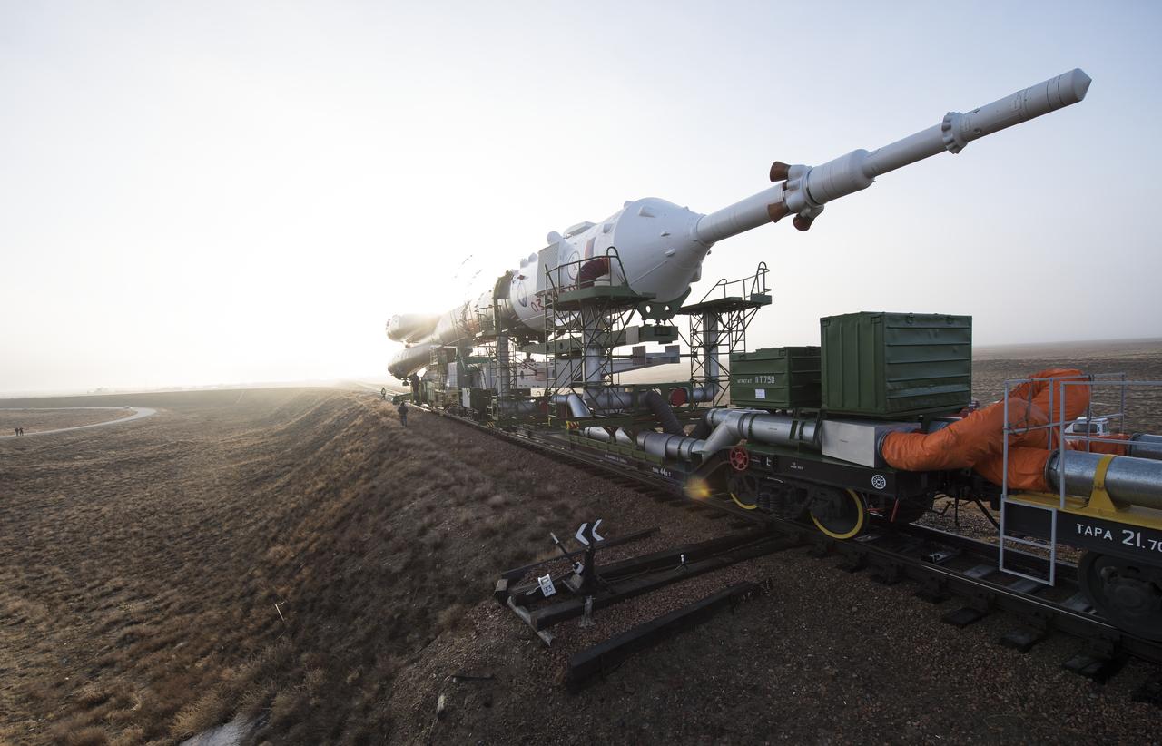 The Soyuz rocket is rolled out by train to the launch pad, Monday, March 19, 2018 at the Baikonur Cosmodrome in Kazakhstan. Expedition 55 crewmembers Ricky Arnold and Drew Feustel of NASA and Oleg Artemyev of Roscosmos are scheduled to launch at 1:44 p.m. Eastern time (11:44 p.m. Baikonur time) on March 21 and will spend the next five months living and working aboard the International Space Station. Photo Credit: (NASA/Joel Kowsky)