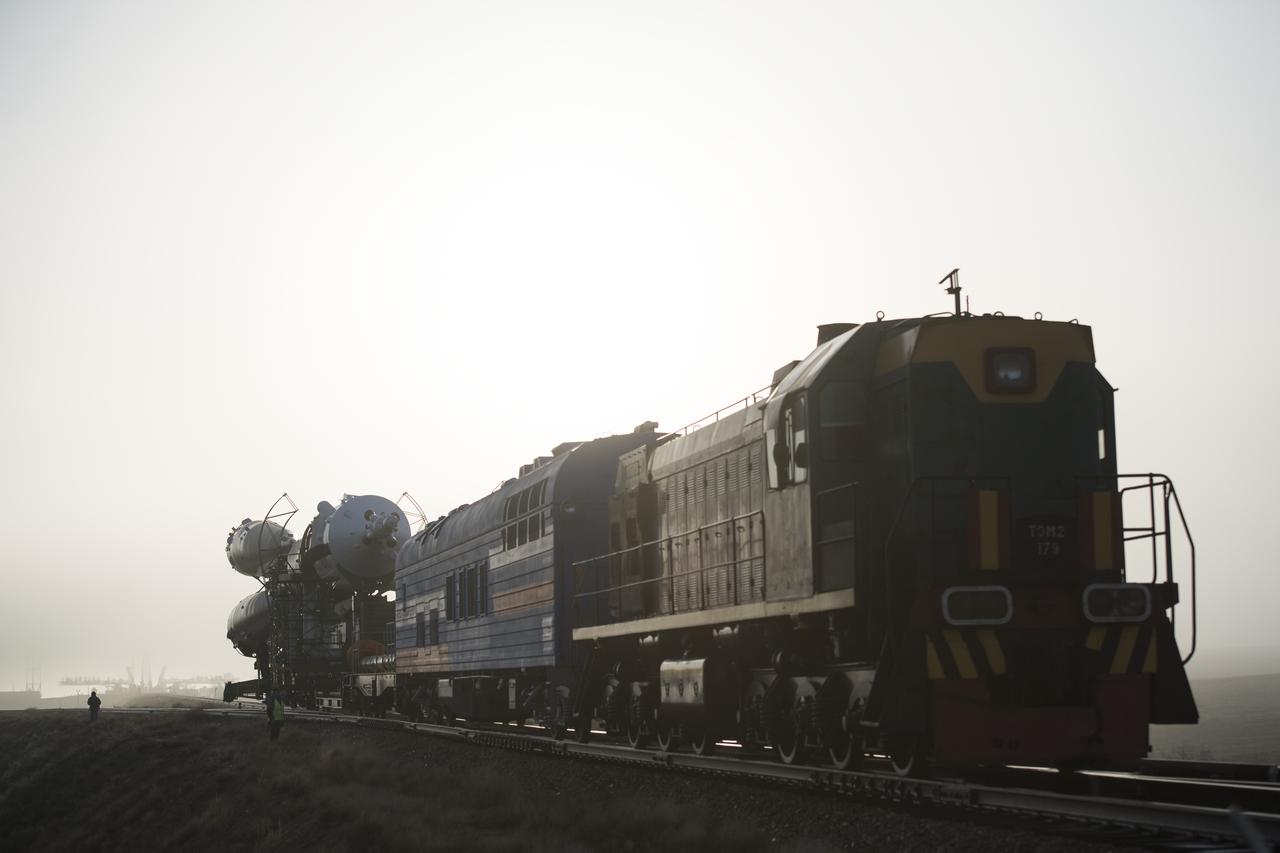 The Soyuz rocket is rolled out by train to the launch pad, Monday, March 19, 2018 at the Baikonur Cosmodrome in Kazakhstan. Expedition 55 crewmembers Ricky Arnold and Drew Feustel of NASA and Oleg Artemyev of Roscosmos are scheduled to launch at 1:44 p.m. Eastern time (11:44 p.m. Baikonur time) on March 21 and will spend the next five months living and working aboard the International Space Station. Photo Credit: (NASA/Joel Kowsky)