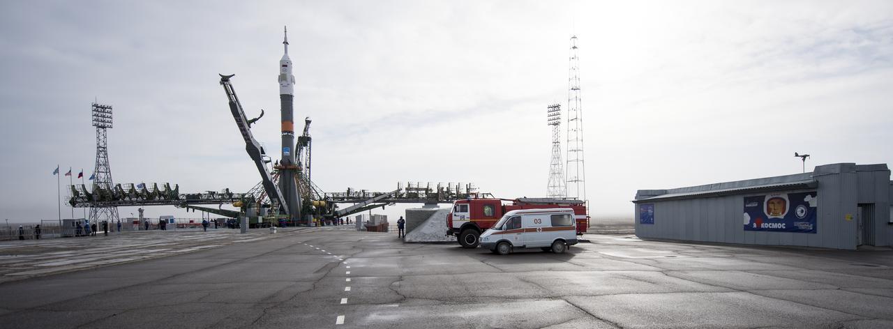 The Soyuz rocket is seen on the launch pad after being raised into a vertical position, Monday, March 19, 2018 at the Baikonur Cosmodrome in Kazakhstan. Expedition 55 crewmembers Ricky Arnold and Drew Feustel of NASA and Oleg Artemyev of Roscosmos are scheduled to launch at 1:44 p.m. Eastern time (11:44 p.m. Baikonur time) on March 21 and will spend the next five months living and working aboard the International Space Station. Photo Credit: (NASA/Joel Kowsky)
