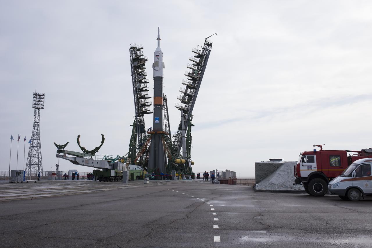 The Soyuz rocket is seen on the launch pad as the service structure arms are closed around it, Monday, March 19, 2018 at the Baikonur Cosmodrome in Kazakhstan. Expedition 55 crewmembers Ricky Arnold and Drew Feustel of NASA and Oleg Artemyev of Roscosmos are scheduled to launch at 1:44 p.m. Eastern time (11:44 p.m. Baikonur time) on March 21 and will spend the next five months living and working aboard the International Space Station. Photo Credit: (NASA/Joel Kowsky)
