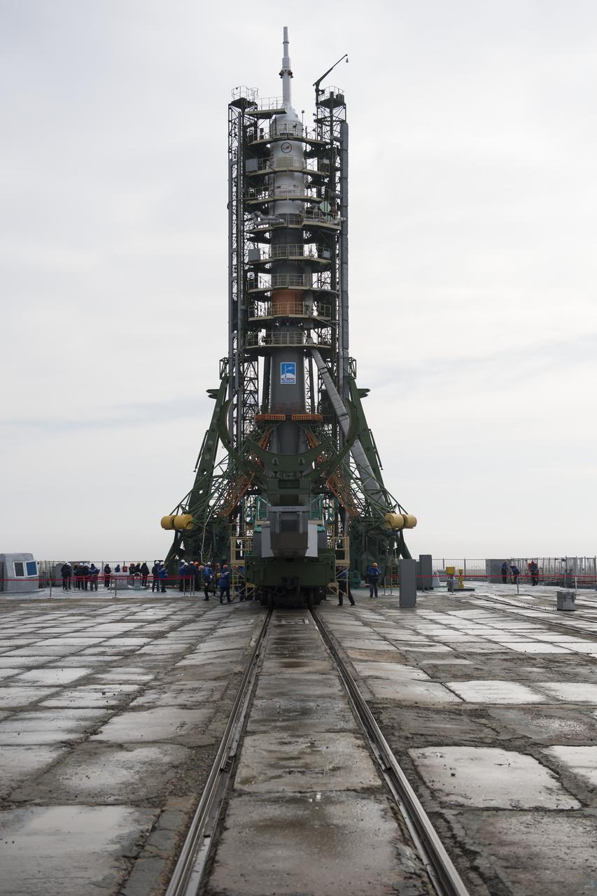 The Soyuz rocket is seen on the launch pad after the service structure arms were closed around it, Monday, March 19, 2018 at the Baikonur Cosmodrome in Kazakhstan. Expedition 55 crewmembers Ricky Arnold and Drew Feustel of NASA and Oleg Artemyev of Roscosmos are scheduled to launch at 1:44 p.m. Eastern time (11:44 p.m. Baikonur time) on March 21 and will spend the next five months living and working aboard the International Space Station. Photo Credit: (NASA/Joel Kowsky)