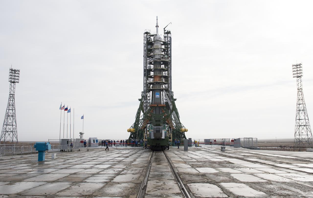 The Soyuz rocket is rolled out by train to the launch pad, (iptcdow}, March 19, 2018 at the Baikonur Cosmodrome in Kazakhstan. Expedition 55 Soyuz Commander Oleg Artemyev of Roscosmos, Ricky Arnold and Drew Feustel of NASA are scheduled to launch aboard their Soyuz MS-08 spacecraft at 11:44pm Baikonur time, 1:44pm EDT, on Wednesday, March, 21.  Photo Credit: (NASA/Joel Kowsky)