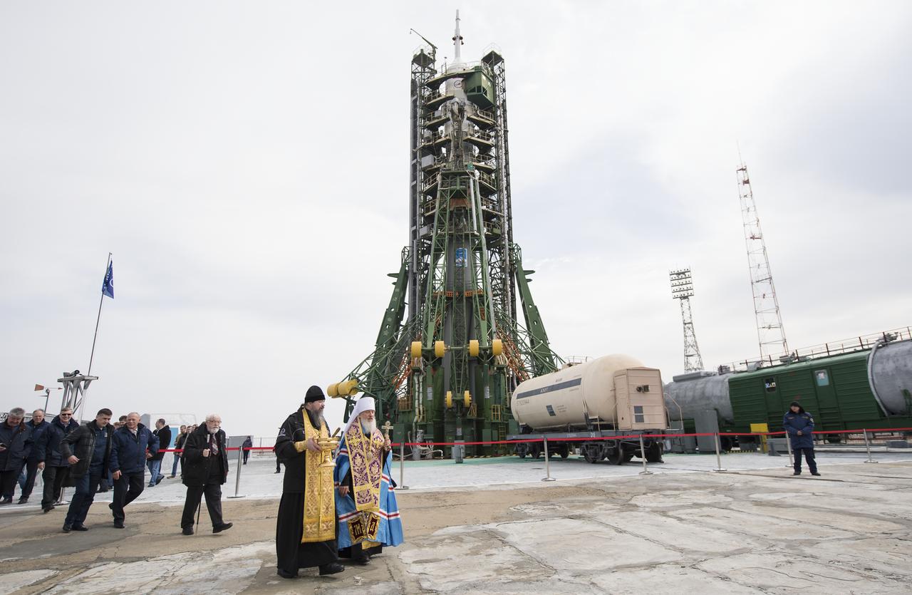 A pair of Orthodox Priests are seen after blessing the Soyuz rocket at the Baikonur Cosmodrome launch pad, Tuesday, March 20, 2018 in Baikonur, Kazakhstan. Expedition 55 Soyuz Commander Oleg Artemyev of Roscosmos, Ricky Arnold and Drew Feustel of NASA are scheduled to launch to the International Space Station aboard the Soyuz MS-08 spacecraft on Wednesday, March, 21. Photo Credit: (NASA/Joel Kowsky)