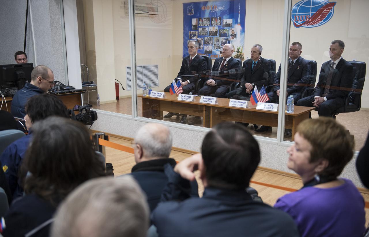 Expedition 55 prime crew members Ricky Arnold of NASA, left, Oleg Artemyev of Roscosmos, second from left, and Drew Feustel of NASA, center, are seen with backup crew members Alexey Ovchinin of Roscosmos, second from right, and Nick Hague of NASA, right, during the State Commission meeting to approve the Soyuz launch of Expedition 55 to the International Space Station, Tuesday, March 20, 2018. Arnold, Artemyev, and Feustel are scheduled to launch to the International Space Station aboard the Soyuz MS-08 spacecraft on Wednesday, March, 21. Photo Credit: (NASA/Joel Kowsky)