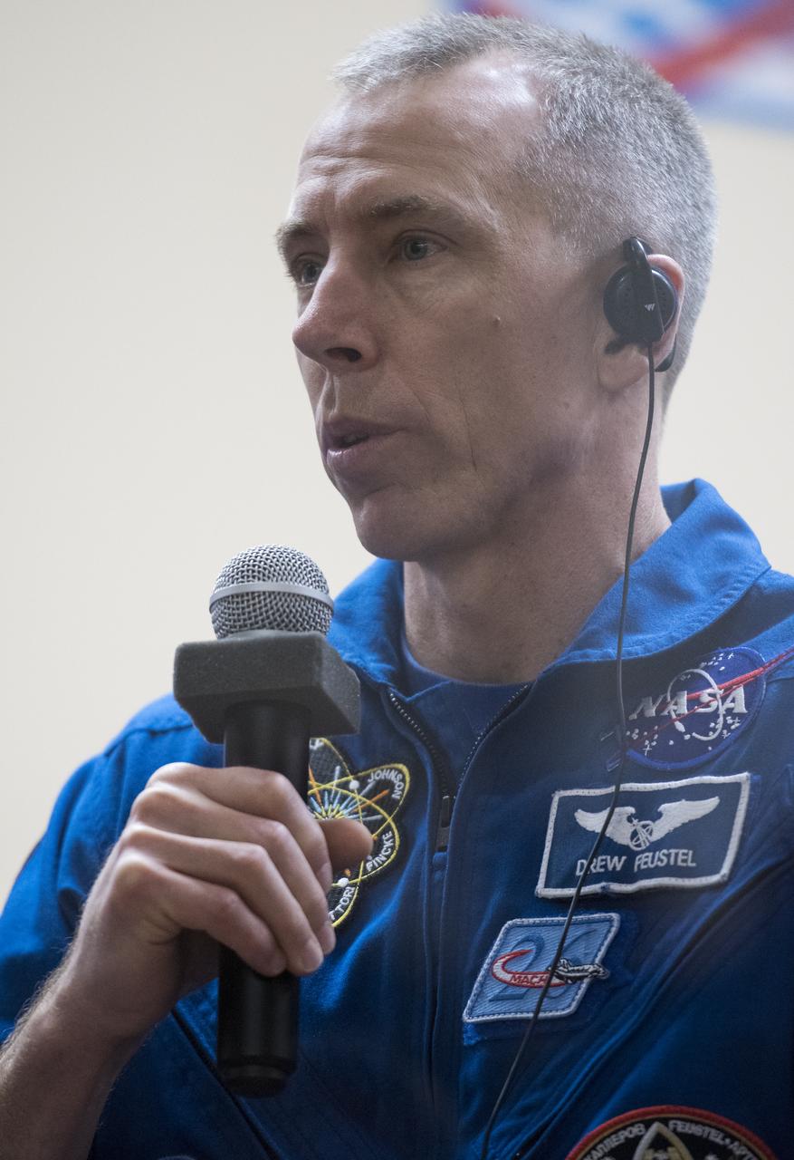 Expedition 55 flight engineer Drew Feustel of NASA answers a question during a press conference, Tuesday, March 20, 2018 a the Cosmonaut Hotel in Baikonur, Kazakhstan. Feustel, Soyuz Commander Oleg Artemyev of Roscosmos, and flight engineer Ricky Arnold of NASA are scheduled to launch to the International Space Station aboard the Soyuz MS-08 spacecraft on Wednesday, March, 21. Photo Credit: (NASA/Joel Kowsky)