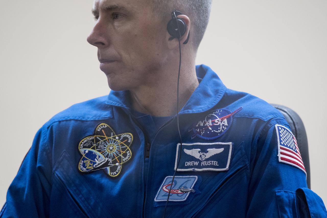 Expedition 55 flight engineer Drew Feustel of NASA is seen in quarantine, behind glass, during a press conference, Tuesday, March 20, 2018 a the Cosmonaut Hotel in Baikonur, Kazakhstan. Feustel, Oleg Artemyev of Roscosmos, and flight engineer Ricky Arnold of NASA are scheduled to launch to the International Space Station aboard the Soyuz MS-08 spacecraft on Wednesday, March, 21. Photo Credit: (NASA/Joel Kowsky)