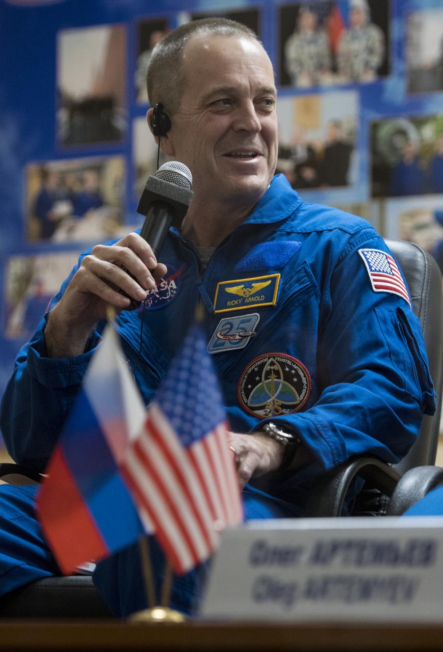 Expedition 55 flight engineer Ricky Arnold answers a question during a press conference, Tuesday, March 20, 2018 a the Cosmonaut Hotel in Baikonur, Kazakhstan. Arnold, Soyuz Commander Oleg Artemyev of Roscosmos, and flight engineer Drew Feustel of NASA are scheduled to launch to the International Space Station aboard the Soyuz MS-08 spacecraft on Wednesday, March, 21. Photo Credit: (NASA/Joel Kowsky)