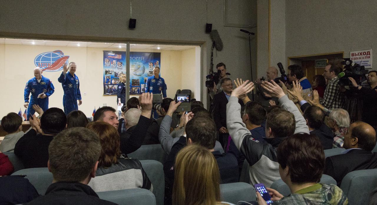 Expedition 55 flight engineer Ricky Arnold of NASA, left, Soyuz Commander Oleg Artemyev of Roscosmos, center, and flight engineer Drew Feustel of NASA, right, are seen at the conclusion of a press conference, Tuesday, March 20, 2018 a the Cosmonaut Hotel in Baikonur, Kazakhstan. Arnold, Artemyev, and Feustel are scheduled to launch to the International Space Station aboard the Soyuz MS-08 spacecraft on Wednesday, March, 21.  Photo Credit: (NASA/Joel Kowsky)
