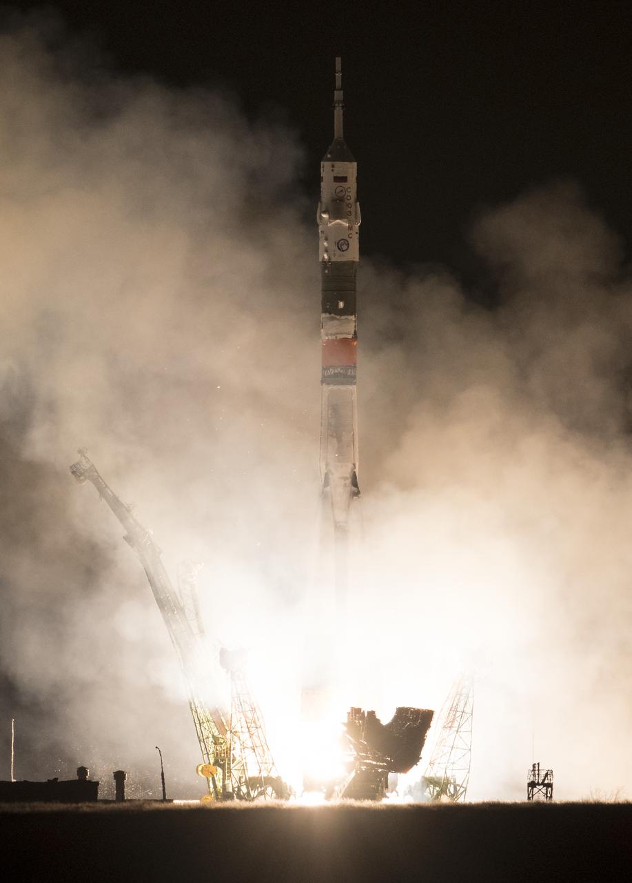 The Soyuz MS-08 rocket is launched with Expedition 55 Soyuz Commander Oleg Artemyev of Roscosmos and flight engineers Ricky Arnold and Drew Feustel of NASA, Wednesday, March 21, 2018 at the Baikonur Cosmodrome in Kazakhstan. Artemyev, Arnold, and Feustel will spend the next five months living and working aboard the International Space Station. Photo Credit: (NASA/Joel Kowsky)