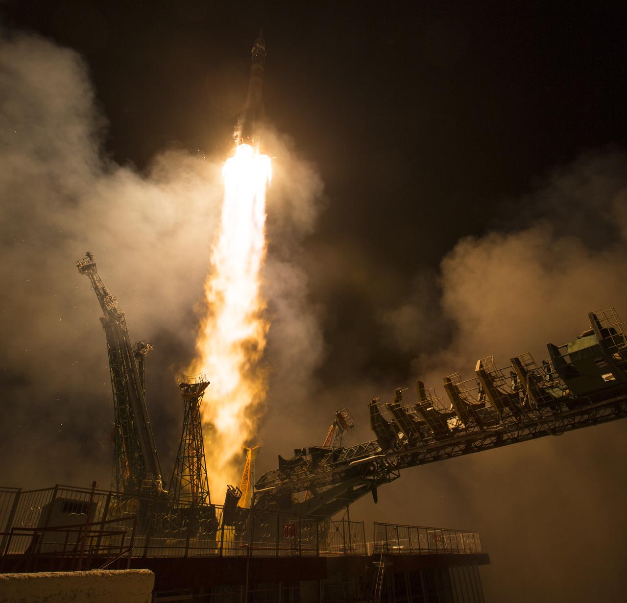 The Soyuz MS-08 rocket is launched with Expedition 55 Soyuz Commander Oleg Artemyev of Roscosmos and flight engineers Ricky Arnold and Drew Feustel of NASA, Wednesday, March 21, 2018 at the Baikonur Cosmodrome in Kazakhstan. Artemyev, Arnold, and Feustel will spend the next five months living and working aboard the International Space Station. Photo Credit: (NASA/Joel Kowsky)