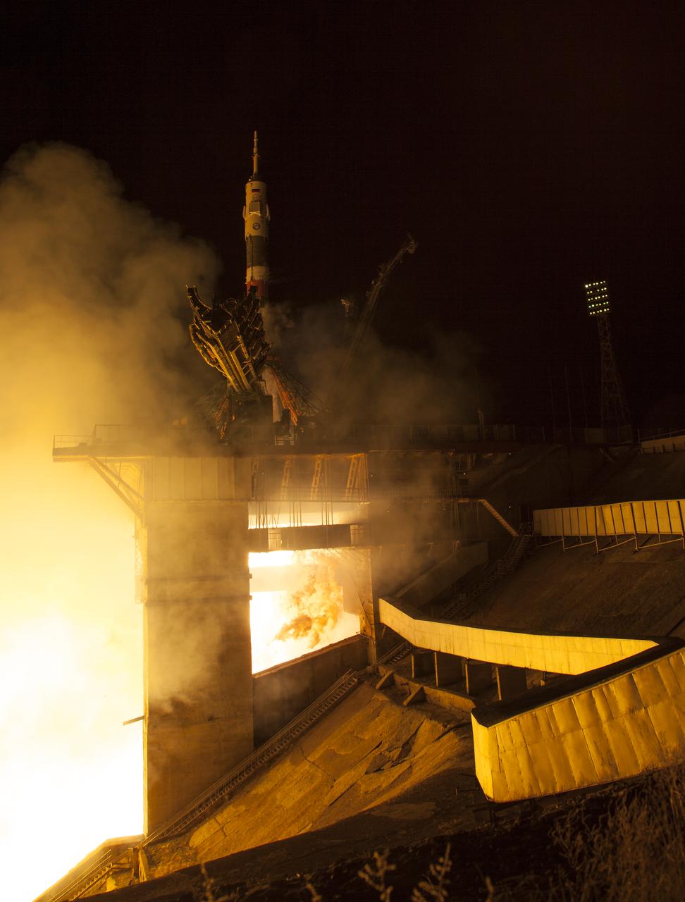 The Soyuz MS-08 rocket is launched with Expedition 55 Soyuz Commander Oleg Artemyev of Roscosmos and flight engineers Ricky Arnold and Drew Feustel of NASA, Wednesday, March 21, 2018 at the Baikonur Cosmodrome in Kazakhstan. Artemyev, Arnold, and Feustel will spend the next five months living and working aboard the International Space Station. Photo Credit: (NASA/Joel Kowsky)