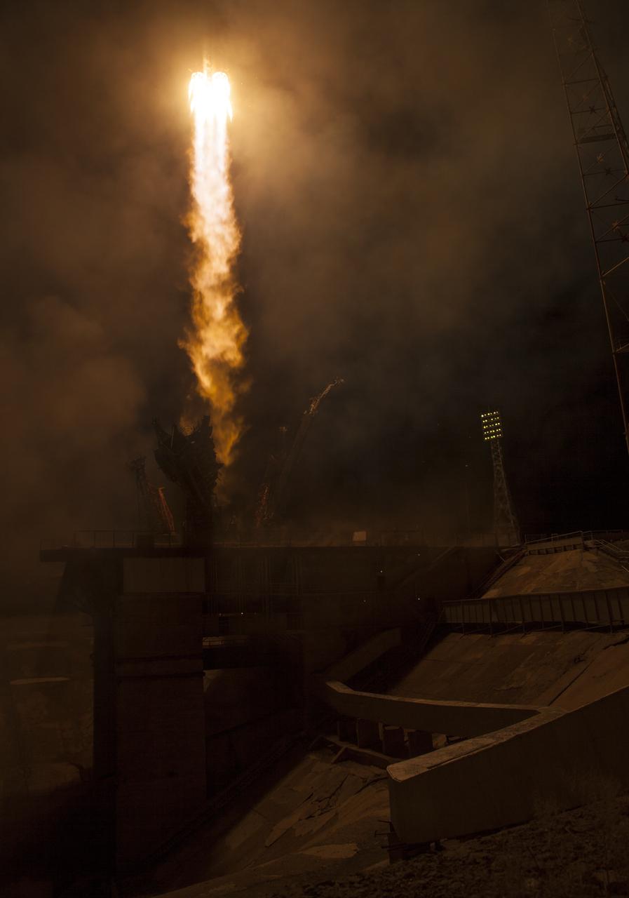 The Soyuz MS-08 rocket is launched with Expedition 55 Soyuz Commander Oleg Artemyev of Roscosmos and flight engineers Ricky Arnold and Drew Feustel of NASA, Wednesday, March 21, 2018 at the Baikonur Cosmodrome in Kazakhstan. Artemyev, Arnold, and Feustel will spend the next five months living and working aboard the International Space Station. Photo Credit: (NASA/Joel Kowsky)