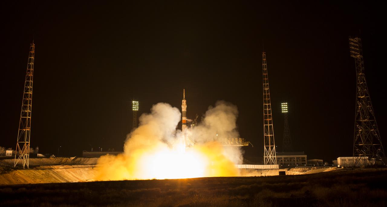 The Soyuz MS-08 rocket is launched with Expedition 55 Soyuz Commander Oleg Artemyev of Roscosmos and flight engineers Ricky Arnold and Drew Feustel of NASA, Wednesday, March 21, 2018 at the Baikonur Cosmodrome in Kazakhstan. Artemyev, Arnold, and Feustel will spend the next five months living and working aboard the International Space Station. Photo Credit: (NASA/Joel Kowsky)