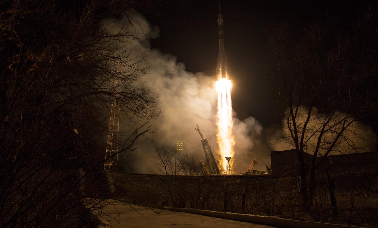 The Soyuz MS-08 rocket is launched with Expedition 55 Soyuz Commander Oleg Artemyev of Roscosmos and flight engineers Ricky Arnold and Drew Feustel of NASA, Wednesday, March 21, 2018 at the Baikonur Cosmodrome in Kazakhstan. Artemyev, Arnold, and Feustel will spend the next five months living and working aboard the International Space Station.  Photo Credit: (NASA/Joel Kowsky)
