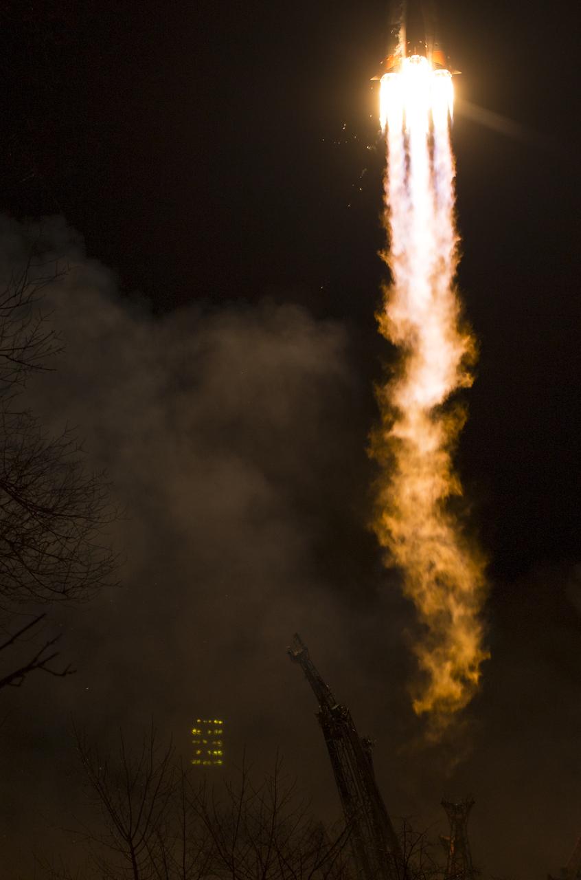 The Soyuz MS-08 rocket is launched with Expedition 55 Soyuz Commander Oleg Artemyev of Roscosmos and flight engineers Ricky Arnold and Drew Feustel of NASA, Wednesday, March 21, 2018 at the Baikonur Cosmodrome in Kazakhstan. Artemyev, Arnold, and Feustel will spend the next five months living and working aboard the International Space Station. Photo Credit: (NASA/Joel Kowsky)