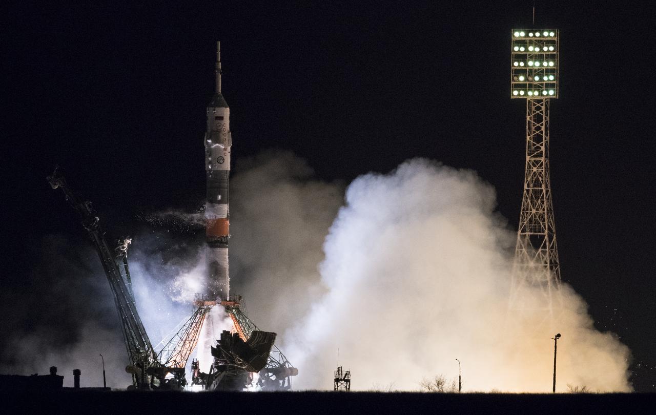 The Soyuz MS-08 rocket is launched with Expedition 55 Soyuz Commander Oleg Artemyev of Roscosmos and flight engineers Ricky Arnold and Drew Feustel of NASA, Wednesday, March 21, 2018 at the Baikonur Cosmodrome in Kazakhstan. Artemyev, Arnold, and Feustel will spend the next five months living and working aboard the International Space Station. Photo Credit: (NASA/Joel Kowsky)