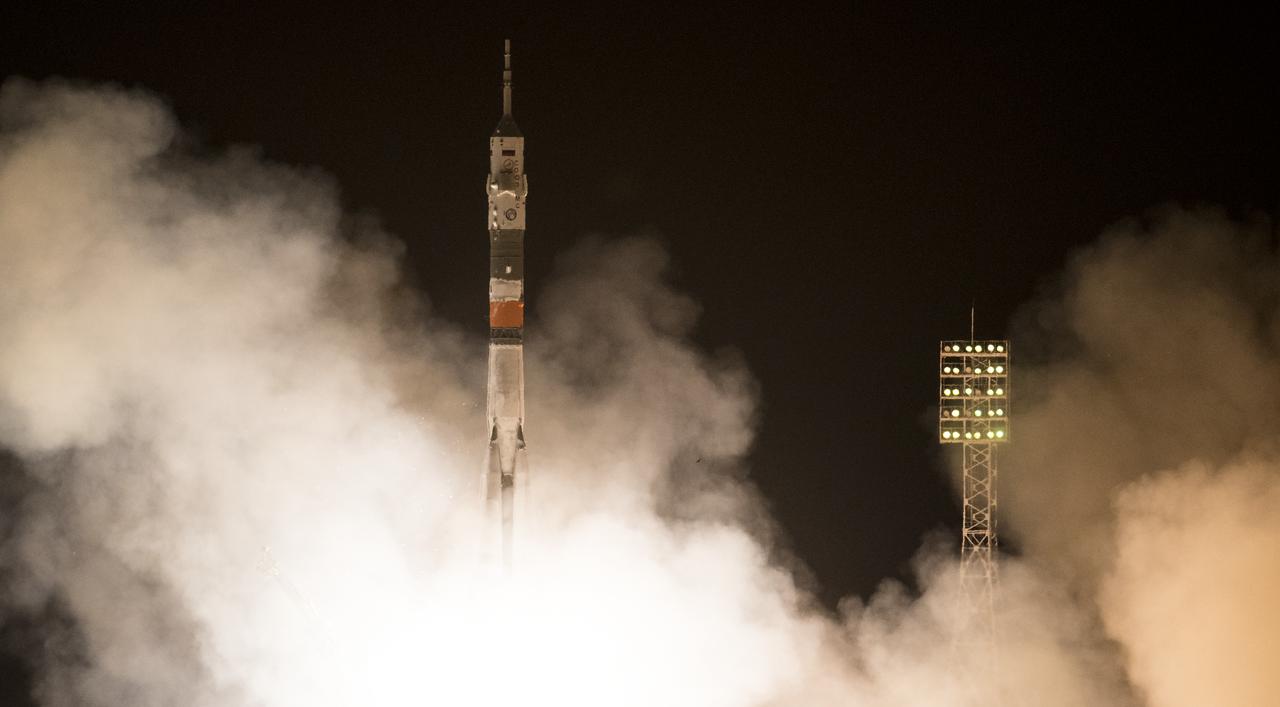 The Soyuz MS-08 rocket is launched with Expedition 55 Soyuz Commander Oleg Artemyev of Roscosmos and flight engineers Ricky Arnold and Drew Feustel of NASA, Wednesday, March 21, 2018 at the Baikonur Cosmodrome in Kazakhstan. Artemyev, Arnold, and Feustel will spend the next five months living and working aboard the International Space Station. Photo Credit: (NASA/Joel Kowsky)