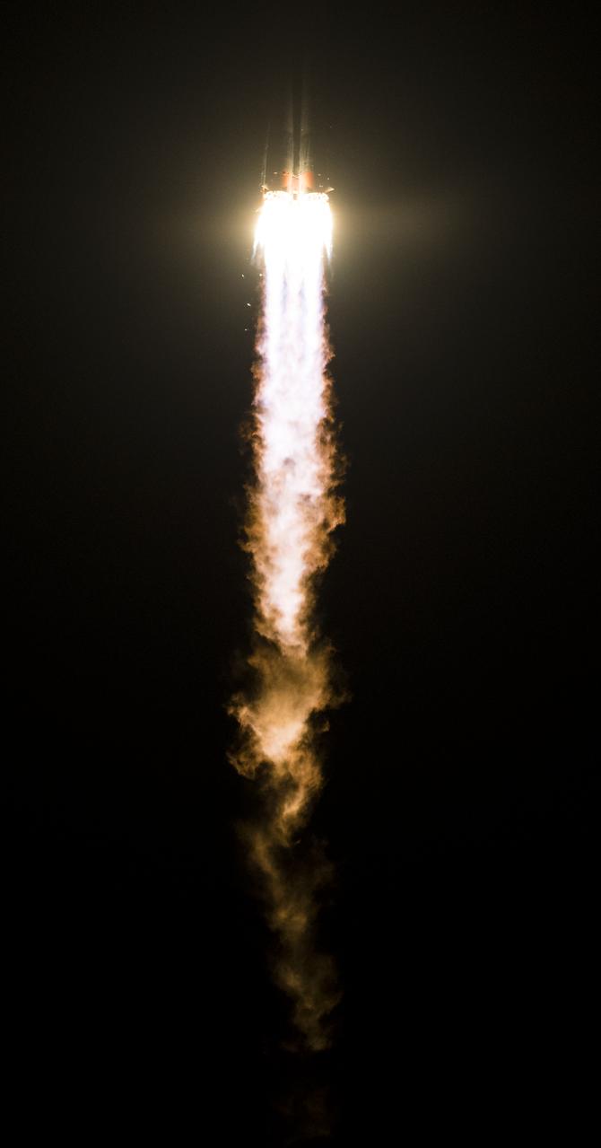 The Soyuz MS-08 rocket is launched with Expedition 55 Soyuz Commander Oleg Artemyev of Roscosmos and flight engineers Ricky Arnold and Drew Feustel of NASA, Wednesday, March 21, 2018 at the Baikonur Cosmodrome in Kazakhstan. Artemyev, Arnold, and Feustel will spend the next five months living and working aboard the International Space Station.  Photo Credit: (NASA/Joel Kowsky)