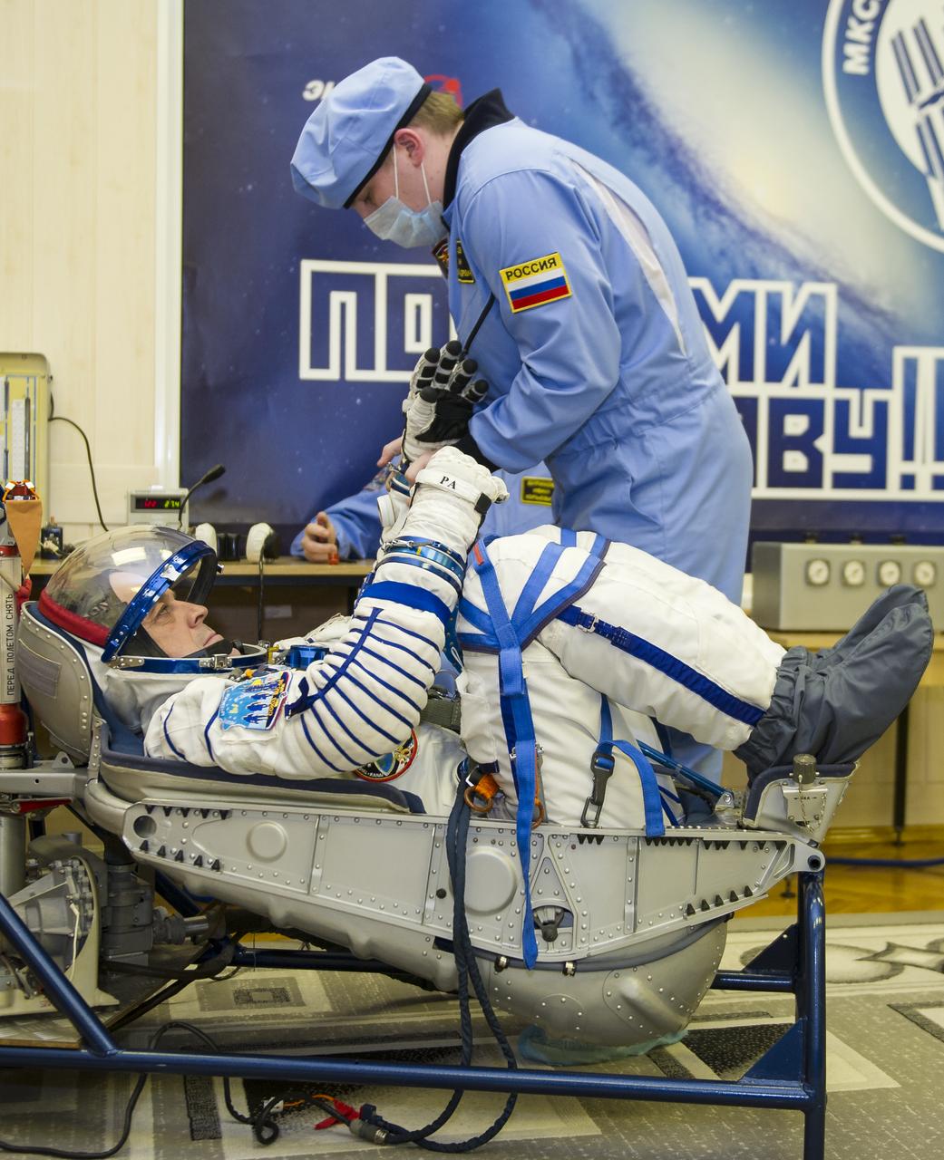 Expedition 55 flight engineer Ricky Arnold of NASA prepares to have his Russian Sokol suit pressure checked in preparation for launch aboard the Soyuz MS-08 spacecraft, Wednesday, March 21, 2018 at the Baikonur Cosmodrome  Kazakhstan. Arnold, Soyuz Commander Oleg Artemyev of Roscosmos, and flight engineer Drew Feustel of NASA launched aboard the Soyuz MS-08 spacecraft at 1:44 p.m. Eastern time (11:44 p.m. Baikonur time) on March 21 to begin their journey to the International Space Station.  Photo Credit: (NASA/GCTC/Irina Peshkova)