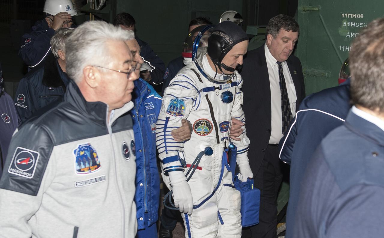 NASA International Space Station Program Manager Kirk Shireman escorts Expedition 55 flight engineer Ricky Arnold of NASA as he prepares to board the Soyuz MS-08 spacecraft for launch, Wednesday, March 21, 2018 at the Baikonur Cosmodrome in Kazakhstan. Arnold and his crewmates Drew Feustel of NASA and Oleg Artemyev of Roscosmos will spend the next five months living and working aboard the International Space Station. Photo Credit: (NASA/Joel Kowsky)