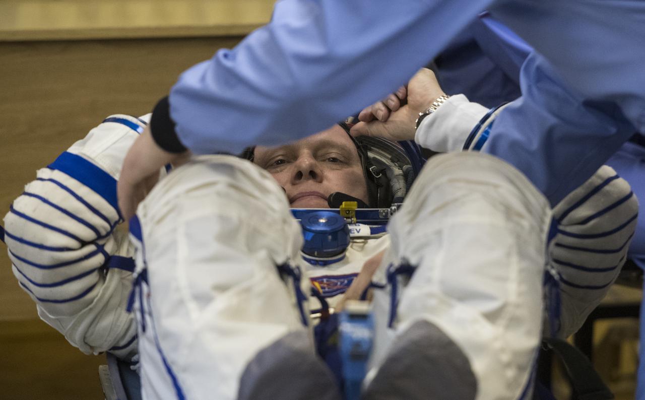 Expedition 55 Soyuz Commander Oleg Artemyev of Roscosmos prepares to have his Russian Sokol suit pressure checked in preparation for launch aboard the Soyuz MS-08 spacecraft, Wednesday, March 21, 2018 at the Baikonur Cosmodrome in Kazakhstan. Artemyev and flight engineers Ricky Arnold and Drew Feustel of NASA launched aboard the Soyuz MS-08 spacecraft at 1:44 p.m. Eastern time (11:44 p.m. Baikonur time) on March 21 to begin their journey to the International Space Station.  Photo Credit: (NASA/Joel Kowsky)