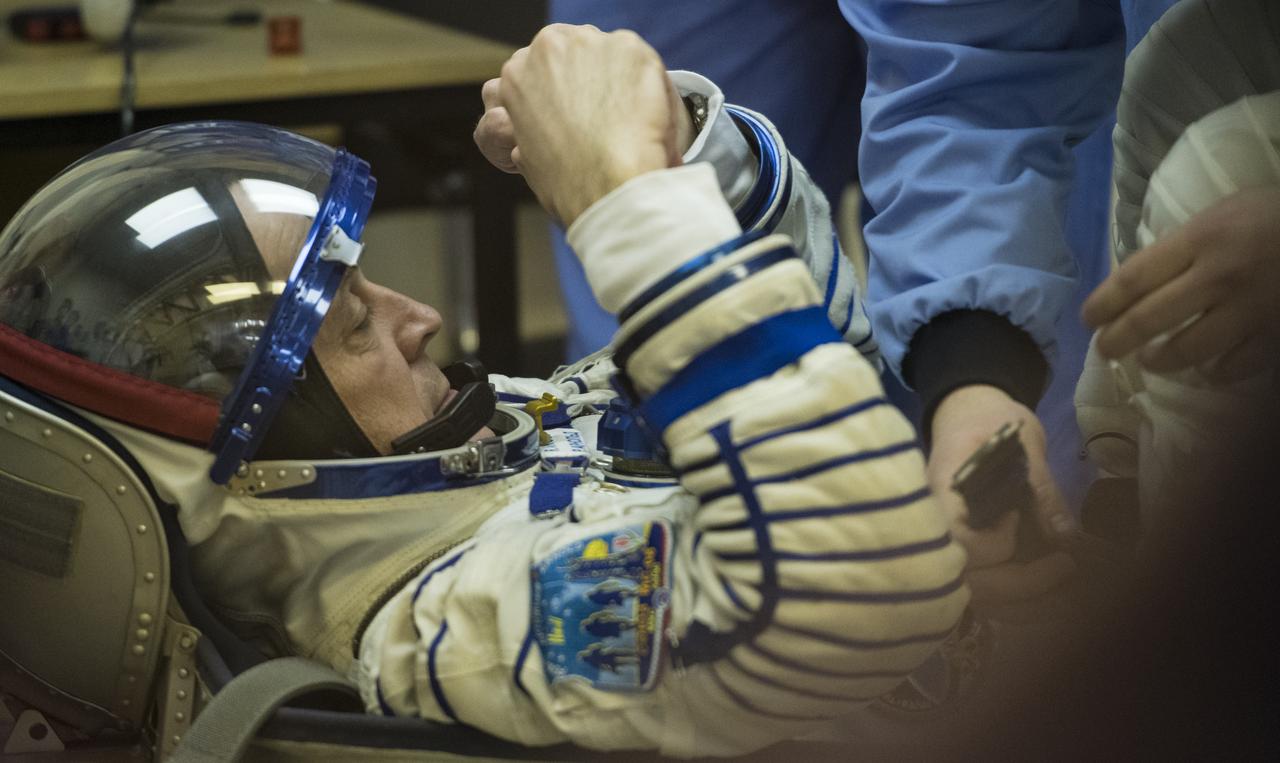 Expedition 55 flight engineer Ricky Arnold of NASA prepares to have his Russian Sokol suit pressure checked in preparation for launch aboard the Soyuz MS-08 spacecraft, Wednesday, March 21, 2018 at the Baikonur Cosmodrome in Kazakhstan. Arnold, Soyuz Commander Oleg Artemyev of Roscosmos, and flight engineer Drew Feustel of NASA launched aboard the Soyuz MS-08 spacecraft at 1:44 p.m. Eastern time (11:44 p.m. Baikonur time) on March 21 to begin their journey to the International Space Station.  Photo Credit: (NASA/Joel Kowsky)