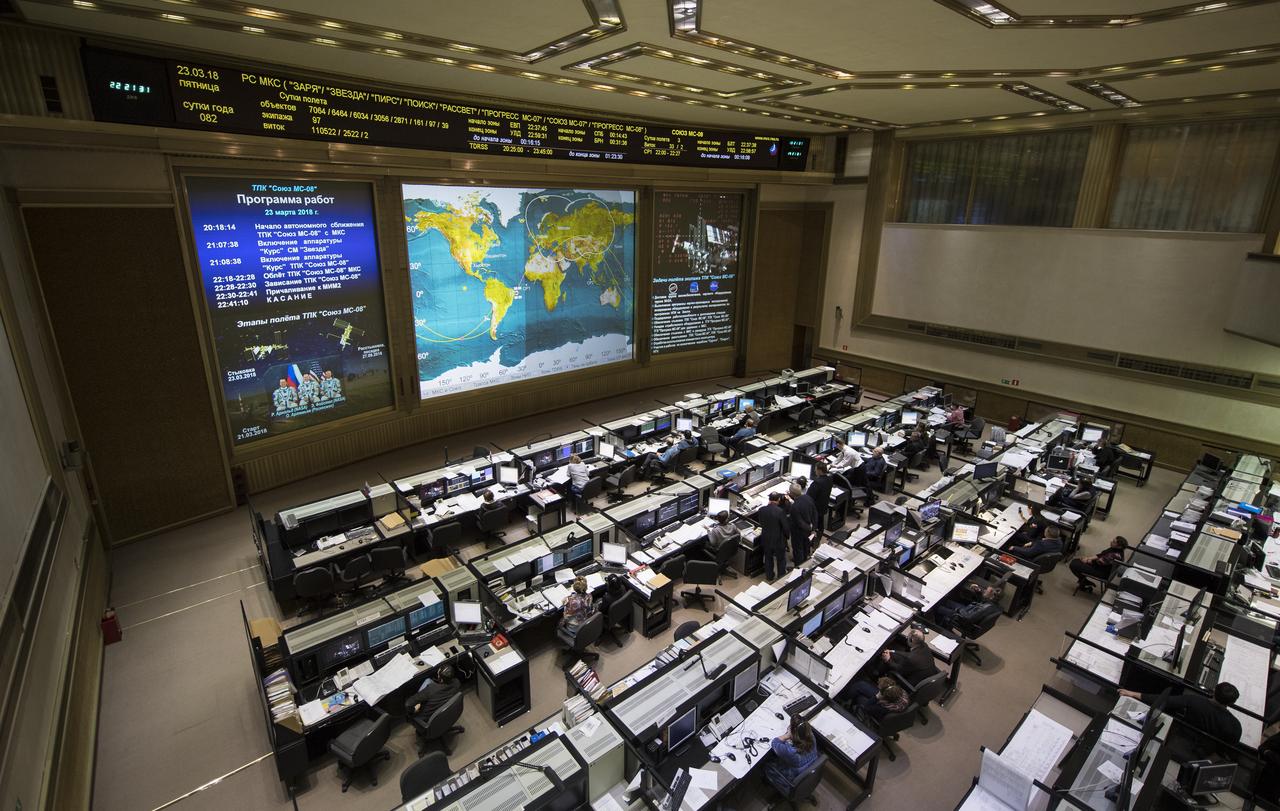 A live view of the International Space Station, as seen by cameras onboard the Soyuz MS-08 spacecraft with Expedition 55-56 crewmembers Oleg Artemyev of Roscosmos and Ricky Arnold and Drew Feustel of NASA, is seen on screens at the Moscow Mission Control Center as the spacecraft approaches for docking, Friday, March 23, 2018 in Korolev, Russia. The Soyuz MS-08 spacecraft carrying Artemyev, Feustel, and Arnold docked at 3:40 p.m. Eastern time (10:40 p.m. Moscow time) and joined Expedition 55 Commander Anton Shkaplerov of Roscosmos, Scott Tingle of NASA, and Norishige Kanai of the Japan Aerospace Exploration Agency (JAXA). Photo Credit: (NASA/Joel Kowsky)