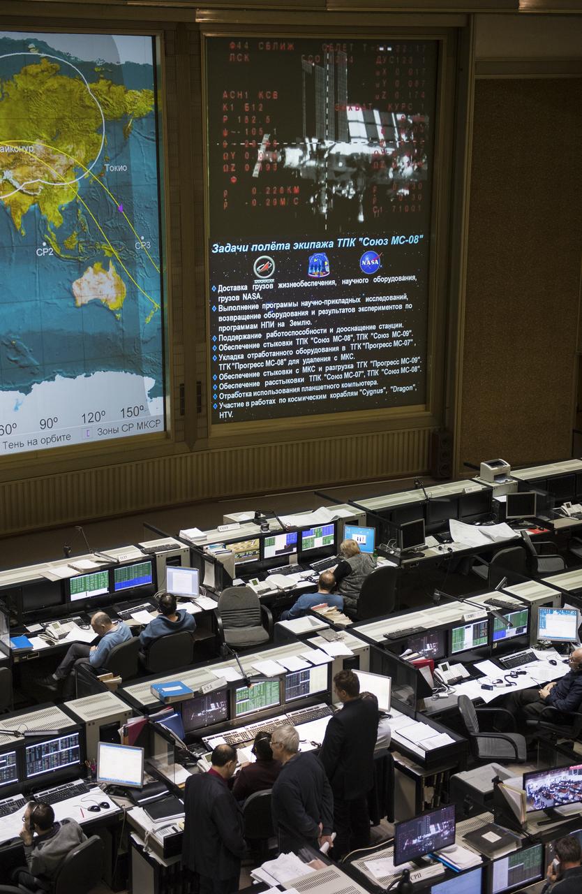 A live view of the International Space Station, as seen by cameras onboard the Soyuz MS-08 spacecraft with Expedition 55-56 crewmembers Oleg Artemyev of Roscosmos and Ricky Arnold and Drew Feustel of NASA, is seen on screens at the Moscow Mission Control Center as the spacecraft approaches for docking, Friday, March 23, 2018 in Korolev, Russia. The Soyuz MS-08 spacecraft carrying Artemyev, Feustel, and Arnold docked at 3:40 p.m. Eastern time (10:40 p.m. Moscow time) and joined Expedition 55 Commander Anton Shkaplerov of Roscosmos, Scott Tingle of NASA, and Norishige Kanai of the Japan Aerospace Exploration Agency (JAXA). Photo Credit: (NASA/Joel Kowsky)