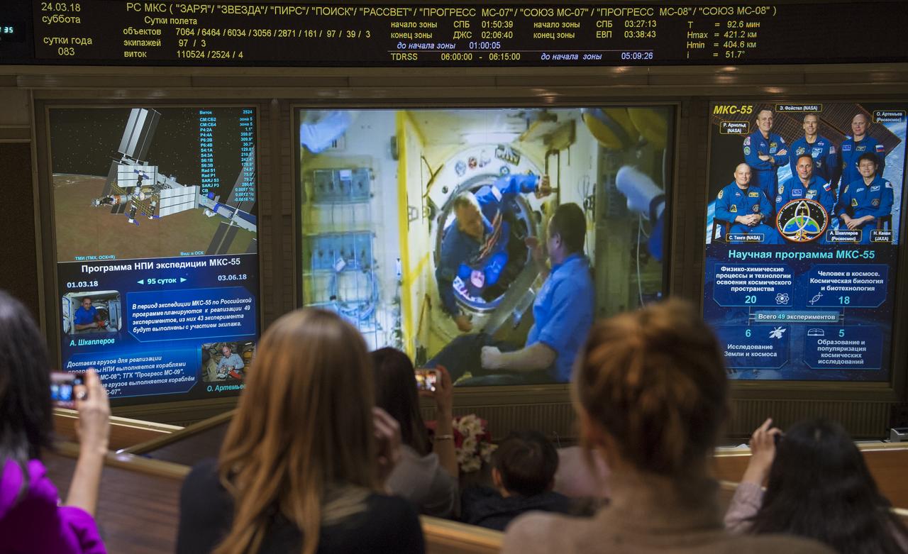 Expedition 55 flight engineer Drew Feustel of NASA is seen after the hatches were opened between the Soyuz MS-08 spacecraft and the International Space Station on screens at the Moscow Mission Control Center in Korolev, Russia, Saturday, March 24, 2018, a few hours after the Soyuz MS-08 docked to the International Space Station. Hatches were opened at 5:48 p.m. Eastern time on March 23 (12:48 a.m. Moscow time on March 24) and Feustel, Oleg Artemyev of Roscosmos, and Ricky Arnold of NASA joined Expedition 55 Commander Anton Shkaplerov of Roscosmos, Scott Tingle of NASA, and Norishige Kanai of the Japan Aerospace Exploration Agency (JAXA) onboard the orbiting laboratory.  Photo Credit: (NASA/Joel Kowsky)