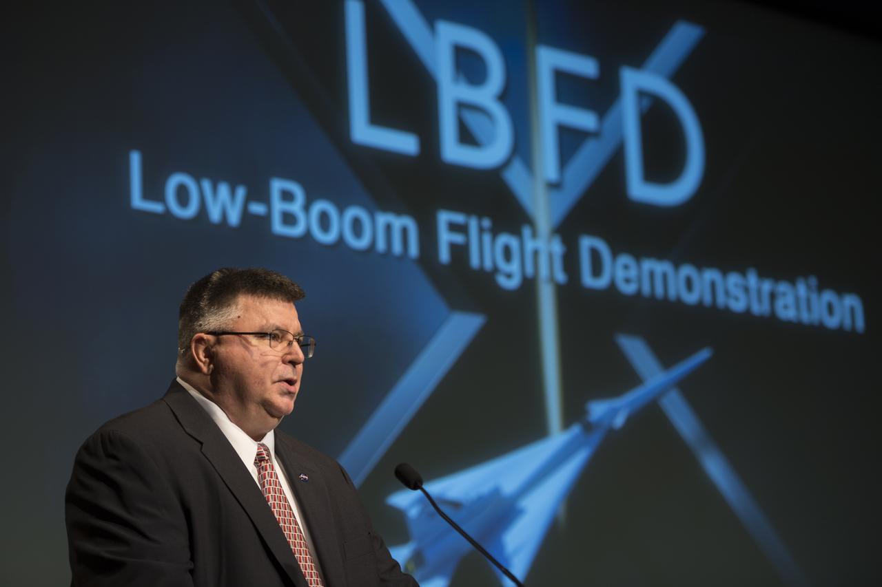J.D. Harrington, public affairs officer, Aeronautics Mission Directorate, NASA, speaks at a briefing on the Low Boom Flight Demonstrator, Tuesday, April 3, 2018 at NASA Headquarters in Washington. This new experimental aircraft will cut cross country travel times in half by flying faster than the speed of sound without creating a sonic boom, enabling travel from New York to Los Angeles in two hours. Photo Credit: (NASA/Aubrey Gemignani)