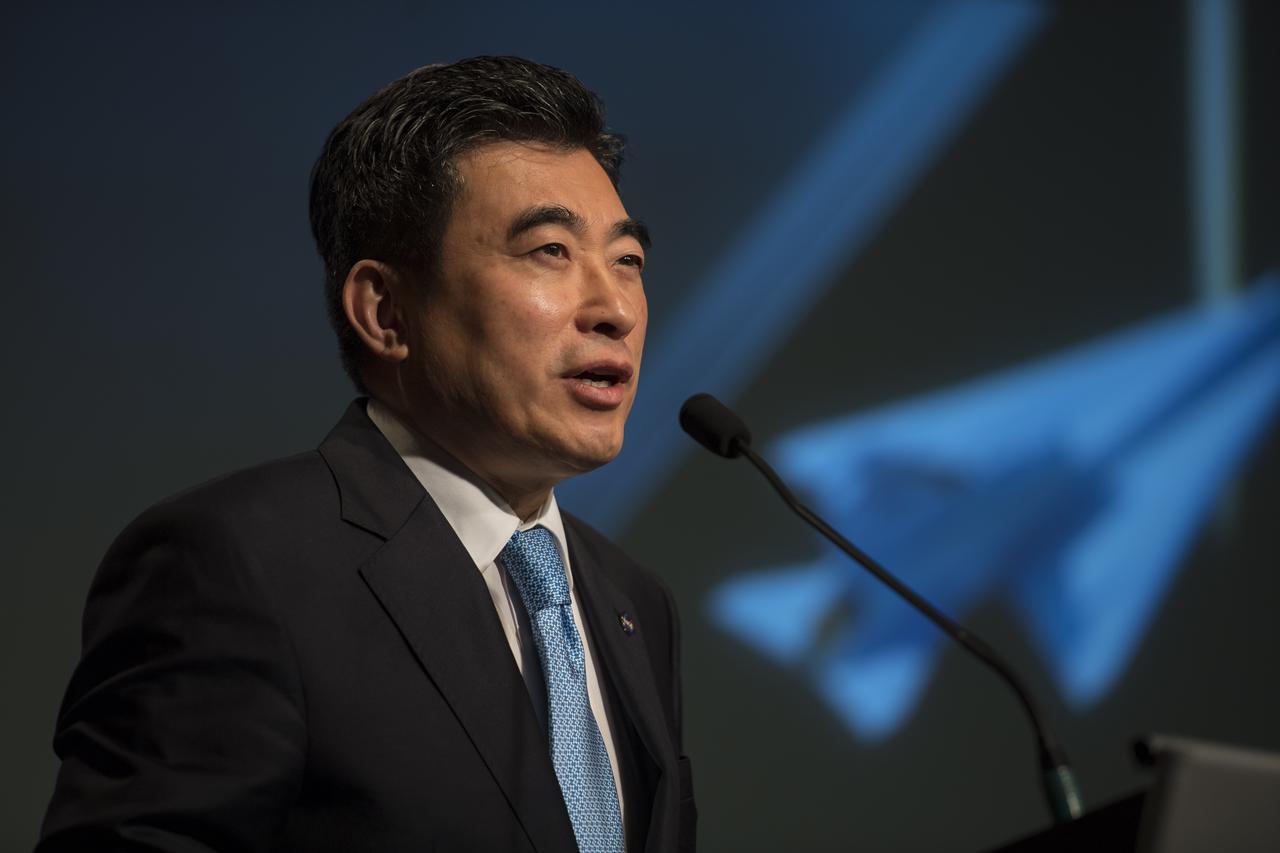 Dr. Jaiwon Shin, associate administrator for the Aeronautics Research Mission Directorate, NASA, announces Lockheed Martin as the winner of the contract to develop a Low Boom Flight Demonstrator at a briefing, Tuesday, April 3, 2018 at NASA Headquarters in Washington. This new experimental aircraft will cut cross country travel times in half by flying faster than the speed of sound without creating a sonic boom, enabling travel from New York to Los Angeles in two hours. Photo Credit: (NASA/Aubrey Gemignani)