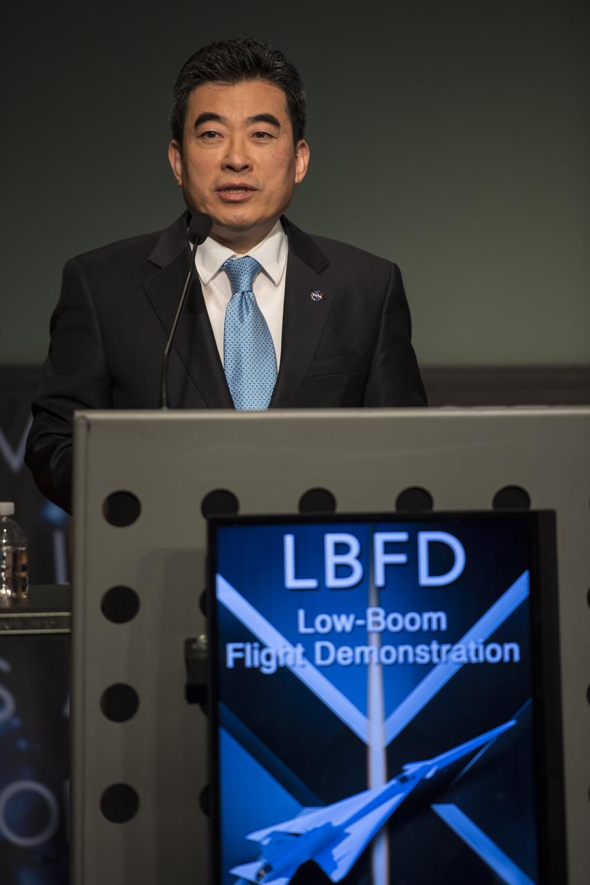 Dr. Jaiwon Shin, associate administrator for the Aeronautics Research Mission Directorate, NASA, announces Lockheed Martin as the winner of the contract to develop a Low Boom Flight Demonstrator at a briefing, Tuesday, April 3, 2018 at NASA Headquarters in Washington. This new experimental aircraft will cut cross country travel times in half by flying faster than the speed of sound without creating a sonic boom, enabling travel from New York to Los Angeles in two hours. Photo Credit: (NASA/Aubrey Gemignani)