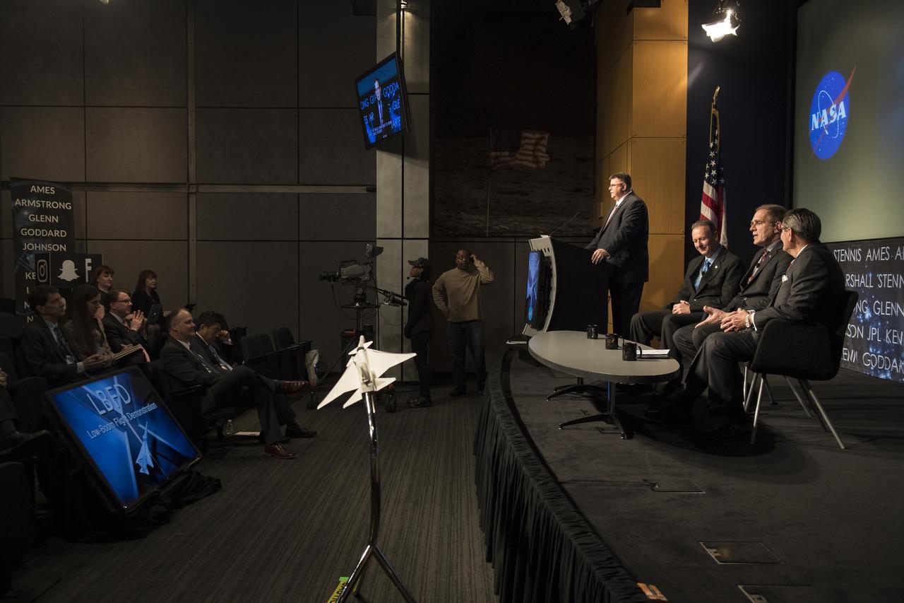 Peter Coen, project manager, Commercial Supersonics Technology Project, Langley Research Center, NASA, center, speaks on a panel with Peter Iosifidis, Lockheed Martin, left, and Dr. Ed Waggoner, NASA, right, at a briefing on the Low Boom Flight Demonstrator, Tuesday, April 3, 2018 at NASA Headquarters in Washington. This new experimental aircraft will cut cross country travel times in half by flying faster than the speed of sound without creating a sonic boom, enabling travel from New York to Los Angeles in two hours. Photo Credit: (NASA/Aubrey Gemignani)