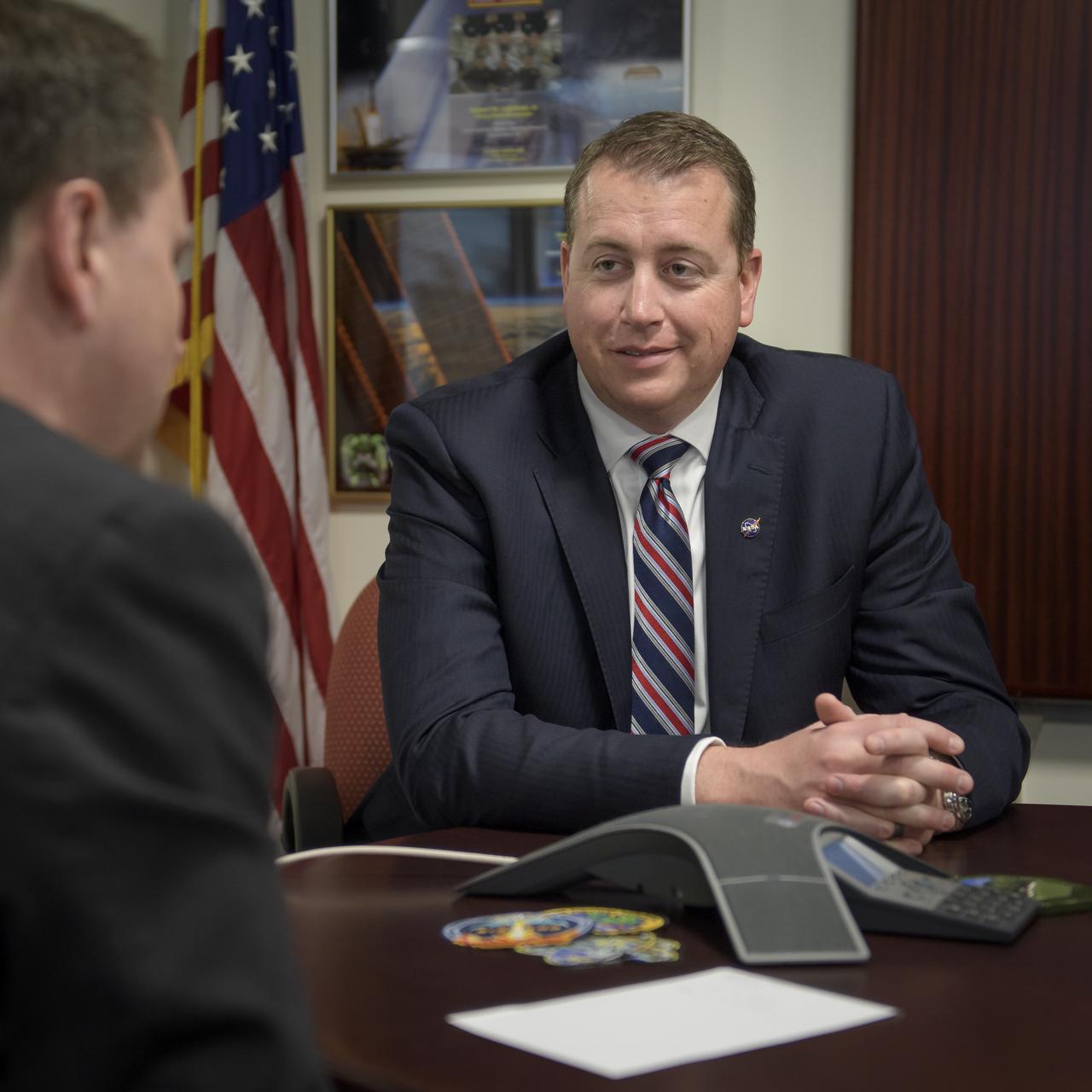 Acting NASA Administrator Robert Lightfoot, left, and newly appointed NASA Chief Financial Officer Jeff DeWit, meet on DeWit's first day in office, Tuesday, April 3, 2018 at NASA Headquarters in Washington. As NASA CFO, DeWit ensures the financial health of the agency, which includes effectively employing agency resources toward the achievement of NASA's strategic plan. Photo Credit: (NASA/Bill Ingalls)