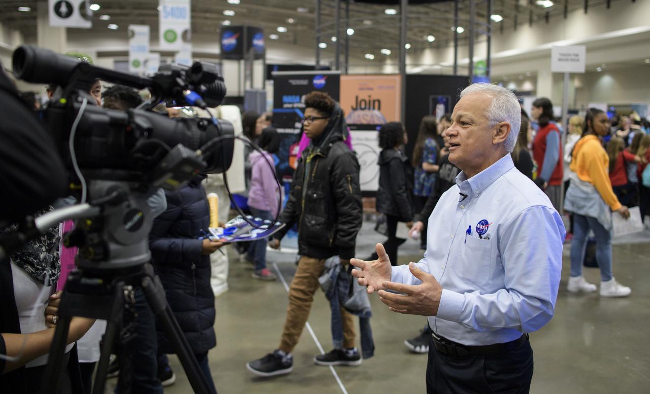 NASA Acting Chief Technologist Douglas Terrier is interviewed by a member of the media during Sneak Peek Friday at the USA Science and Engineering Festival, Friday, April 6, 2018 at the Walter E. Washington Convention Center in Washington, DC.  The festival is open to the public April 7-8.  Photo Credit: (NASA/Joel Kowsky)