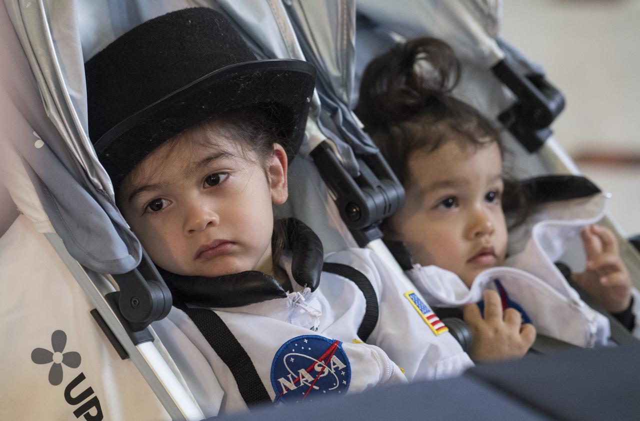 Some young visitors are seen at one of NASA's exhibits at the Earth Day event on Thursday, April 19, 2018 at Union Station in Washington, D.C. Photo Credit: (NASA/Aubrey Gemignani)