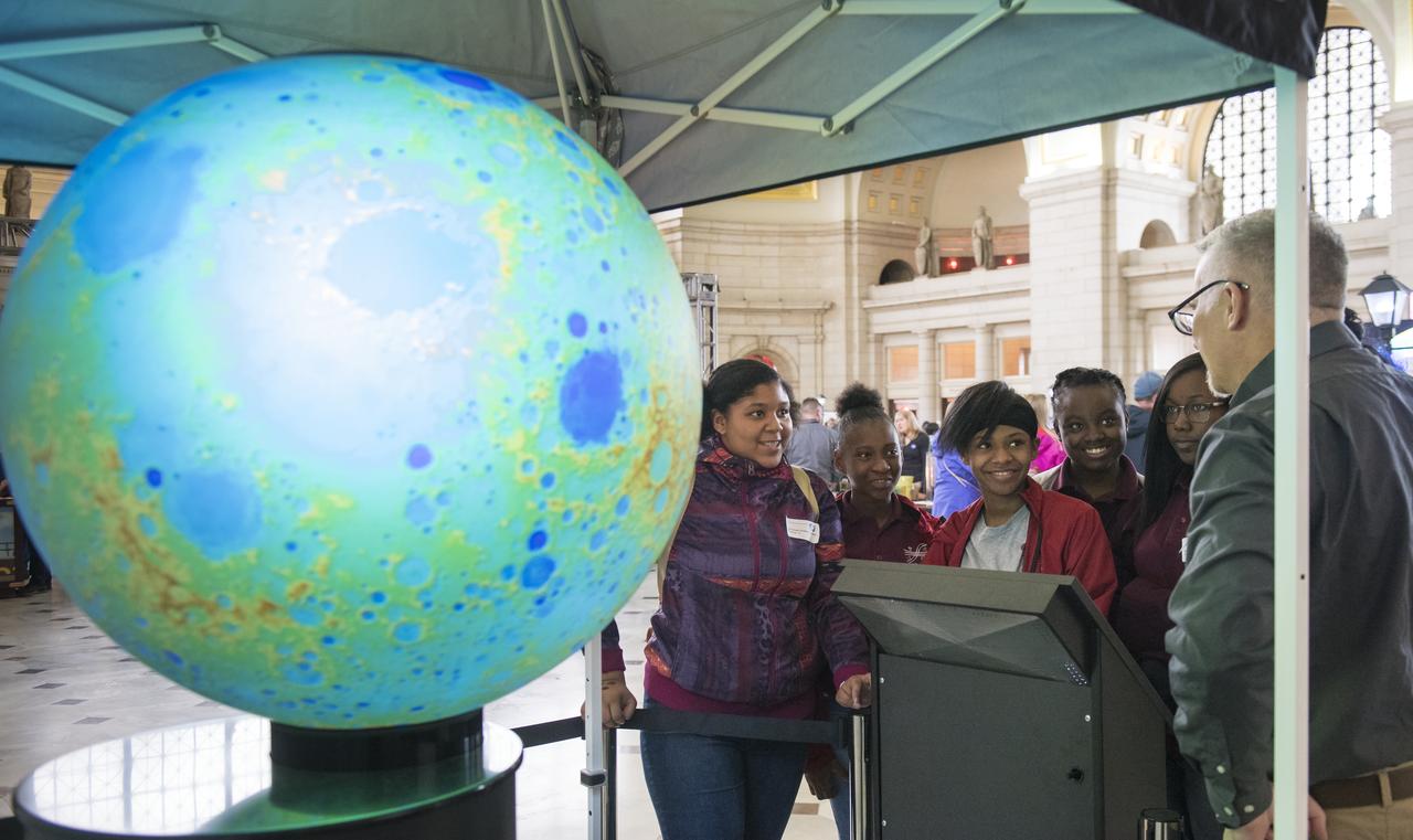 Visitors explore one of NASA's exhibits at the Earth Day event on Thursday, April 19, 2018 at Union Station in Washington, D.C. Photo Credit: (NASA/Aubrey Gemignani)