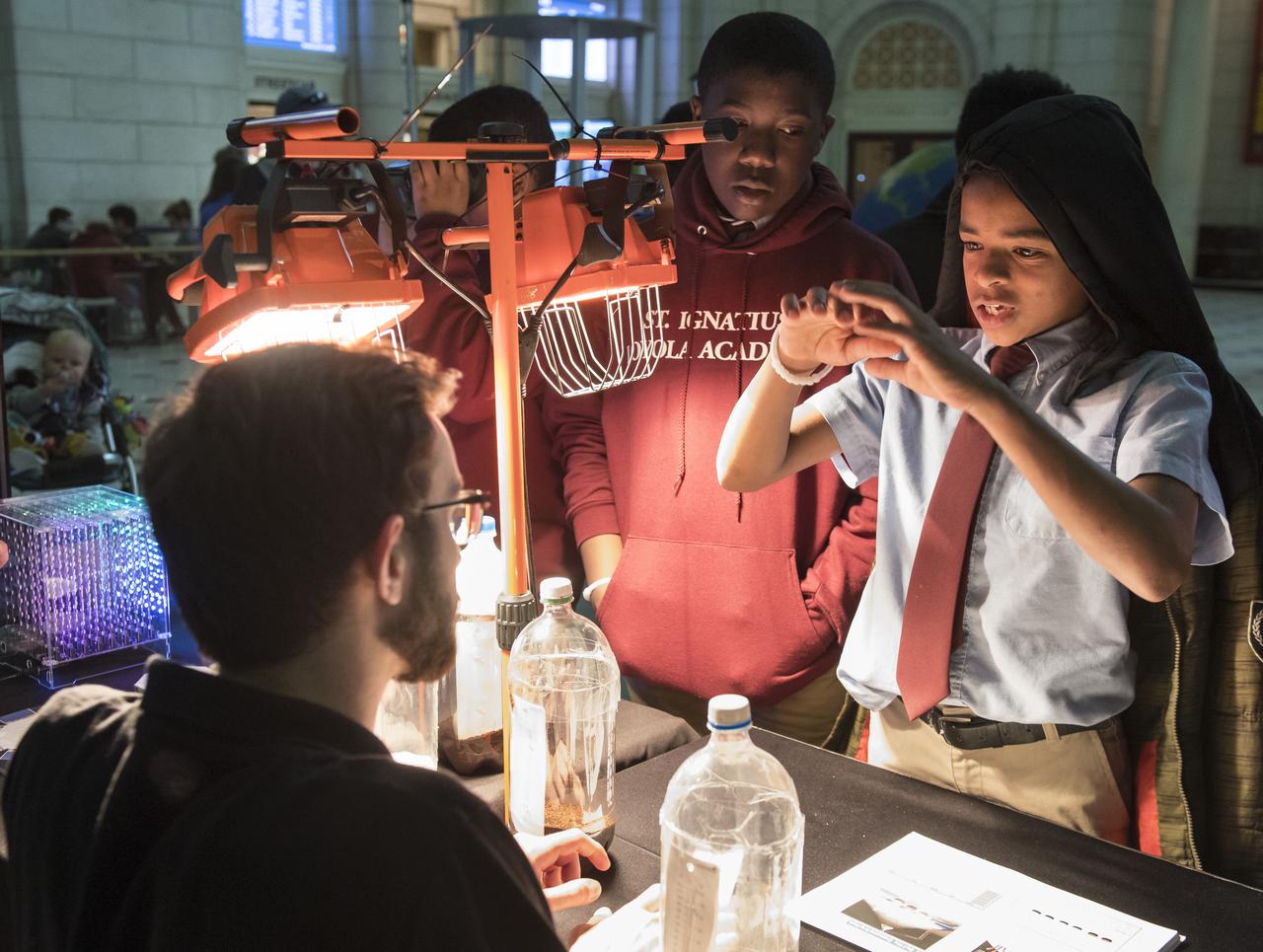 Visitors explore one of NASA's exhibits at the Earth Day event on Thursday, April 19, 2018 at Union Station in Washington, D.C. Photo Credit: (NASA/Aubrey Gemignani)