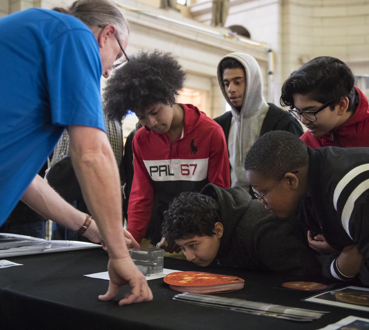 Visitors explore one of NASA's exhibits at the Earth Day event on Thursday, April 19, 2018 at Union Station in Washington, D.C. Photo Credit: (NASA/Aubrey Gemignani)