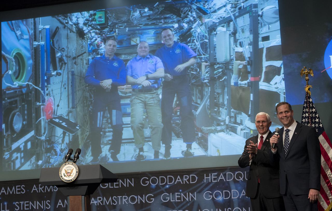 Vice President Mike Pence and NASA Administrator Jim Bridenstine talk with NASA astronauts Andrew Feustel, Scott Tingle, and Ricky Arnold who are onboard the International Space Station, Monday, April 23, 2018 at NASA Headquarters in Washington. Bridenstine was just sworn in by the Vice President as NASA's 13th Administrator. Photo Credit: (NASA/Joel Kowsky)
