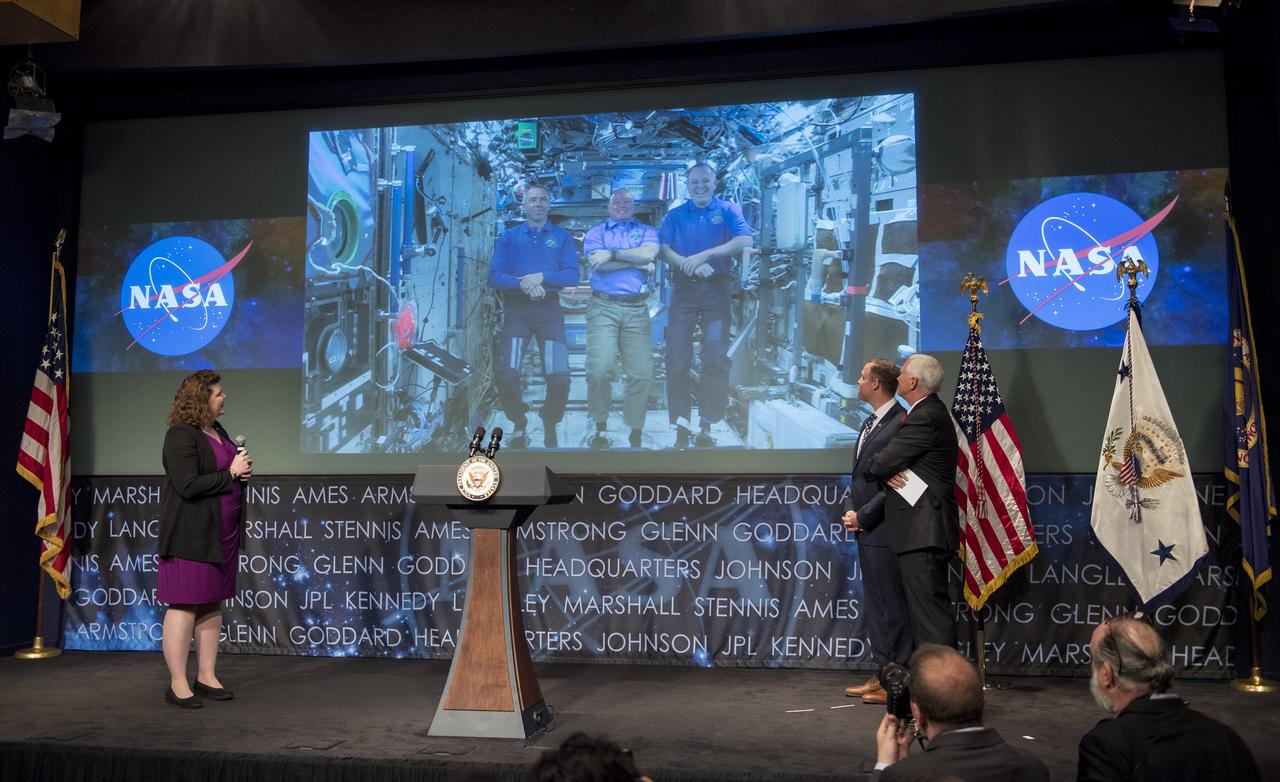 Jen Rae Wang, NASA Associate Administrator for NASA’s Office of Communications, left, NASA Administrator Jim Bridenstine, and Vice President Mike Pence, talk with NASA astronauts Scott Tingle, Andrew Feustel, and Ricky Arnold who are onboard the International Space Station, Monday, April 23, 2018 at NASA Headquarters in Washington. Bridenstine was just sworn in by the Vice President as NASA's 13th Administrator. Photo Credit: (NASA/Joel Kowsky)